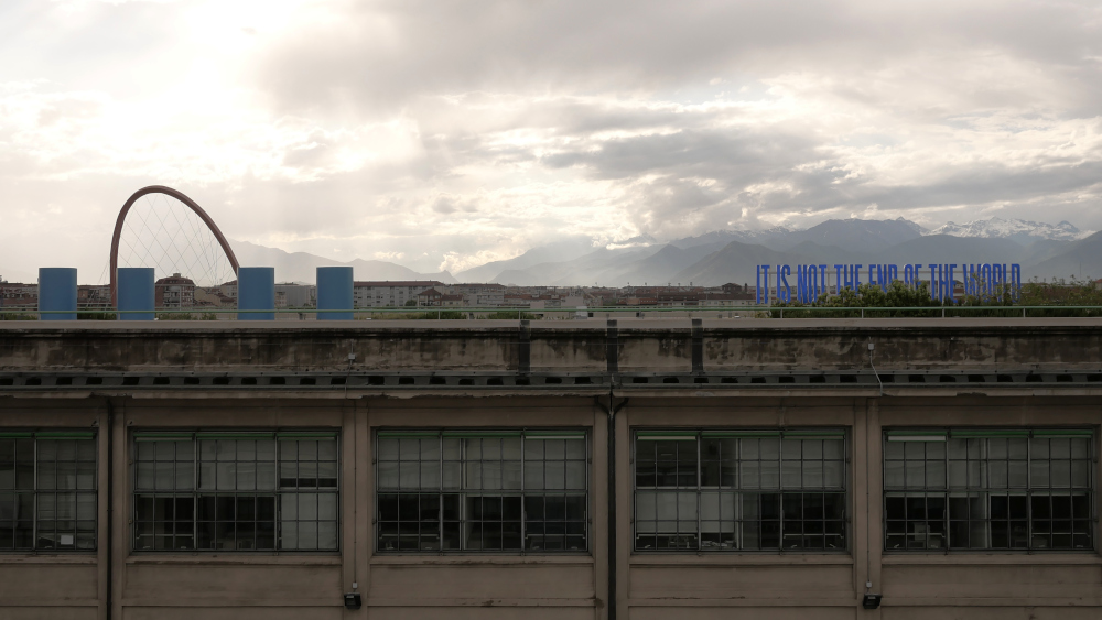 View from the rooftop of the Lingotto, the conference venue. On the top left, you can see part of the Olympic arc, on the top right the snowy mountains surrounding the city. The roof was the only relatively quiet place in kilometers.