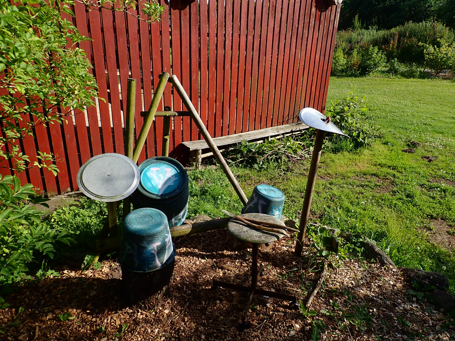A drum set made of old kitchen pots and other recycled materials
