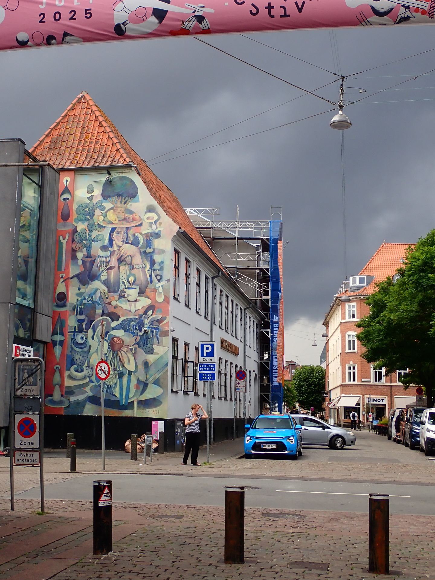 A colorful building against a gray sky