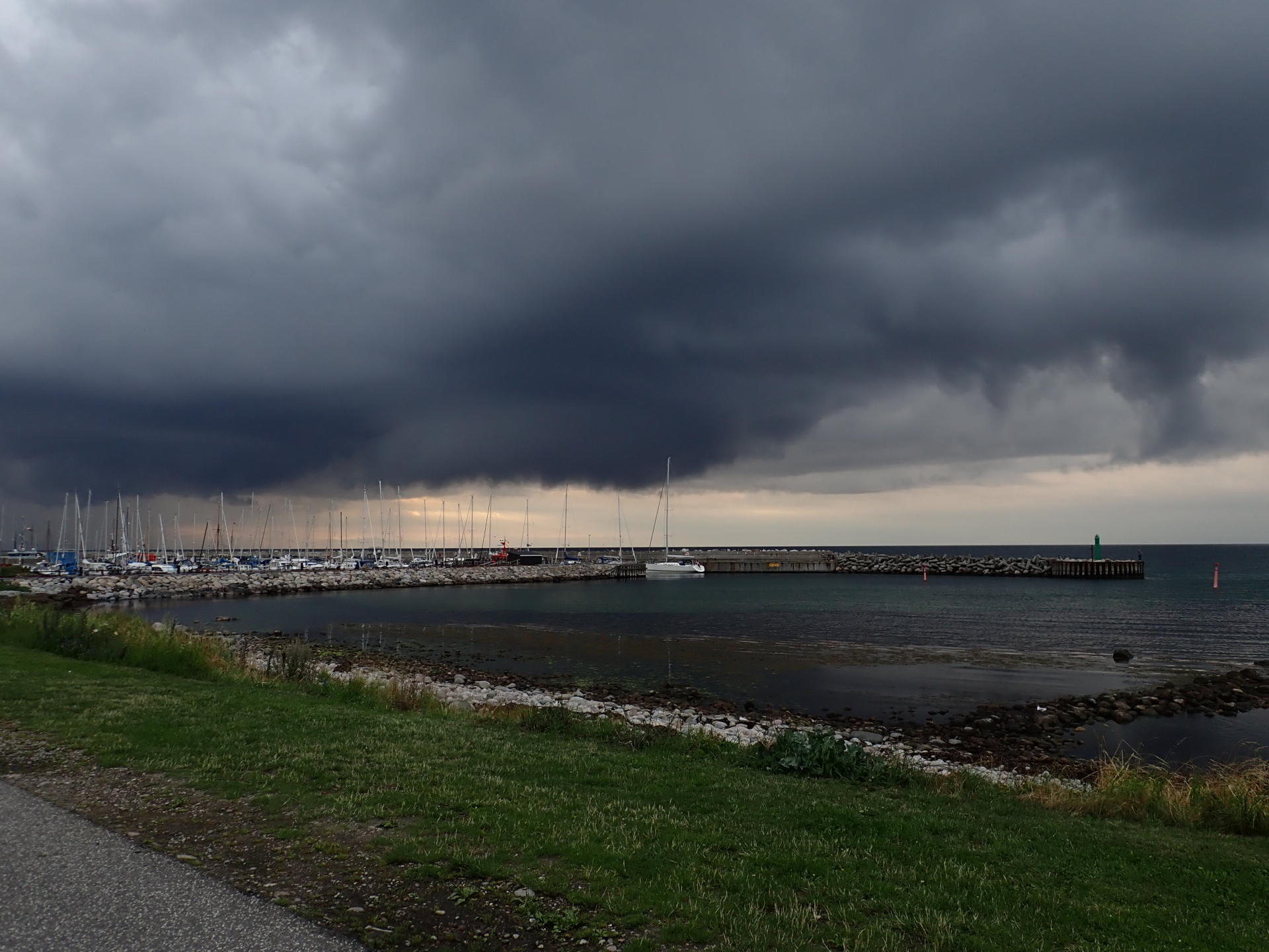 A small marina against a stormy sky