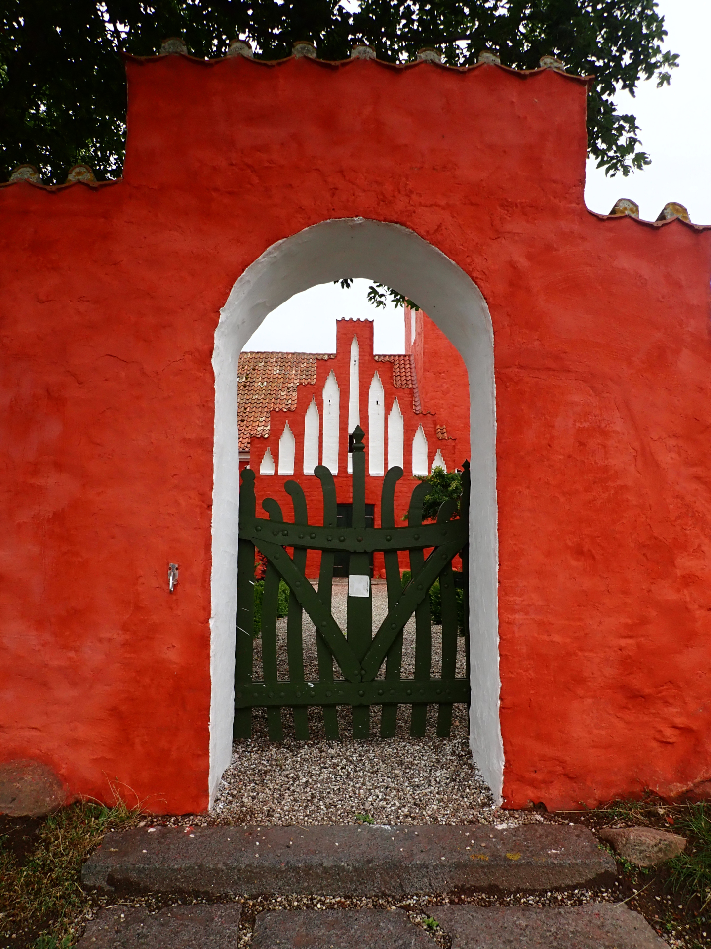 Entrance of a bright red church